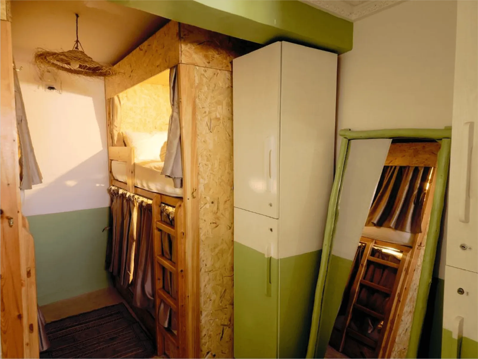 Dorm beds with private curtains at Tazuri